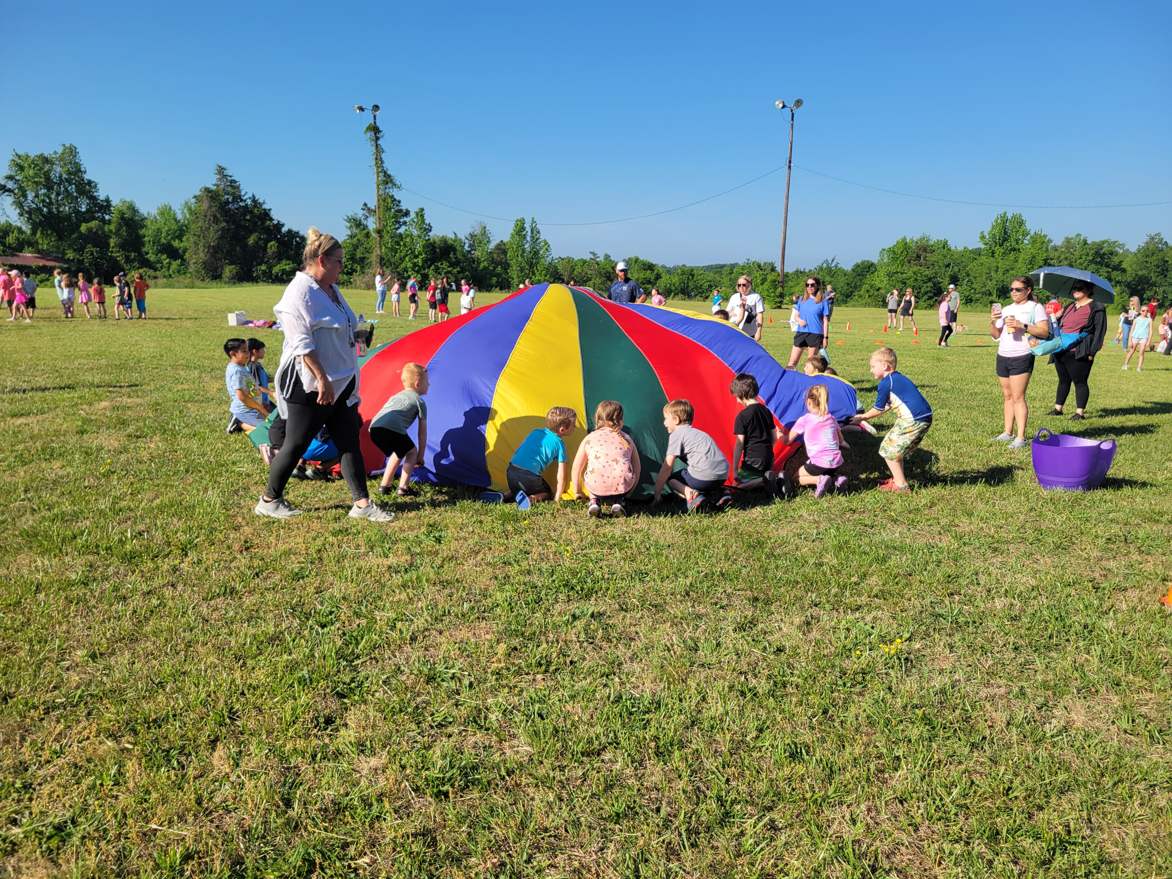 Children Playing with Parachute on Field Day
