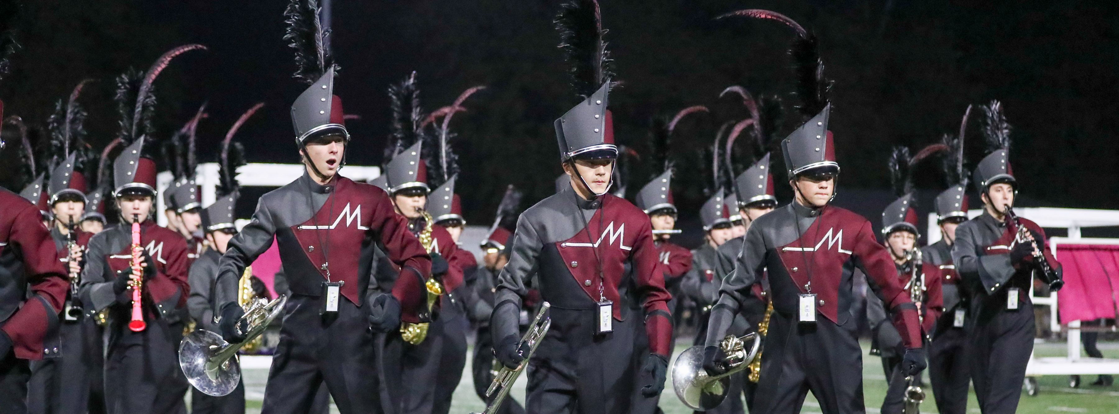 Marching band students during a field performance