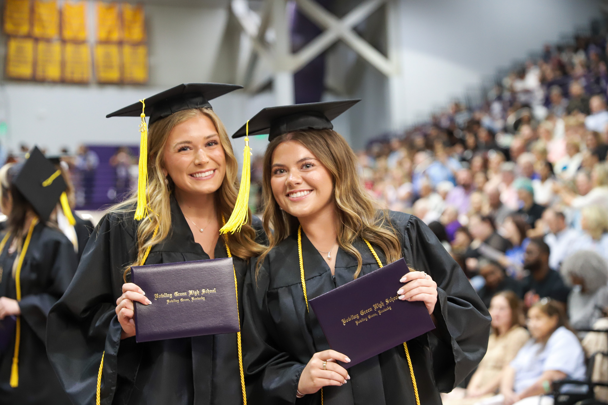 Graduates with diplomas