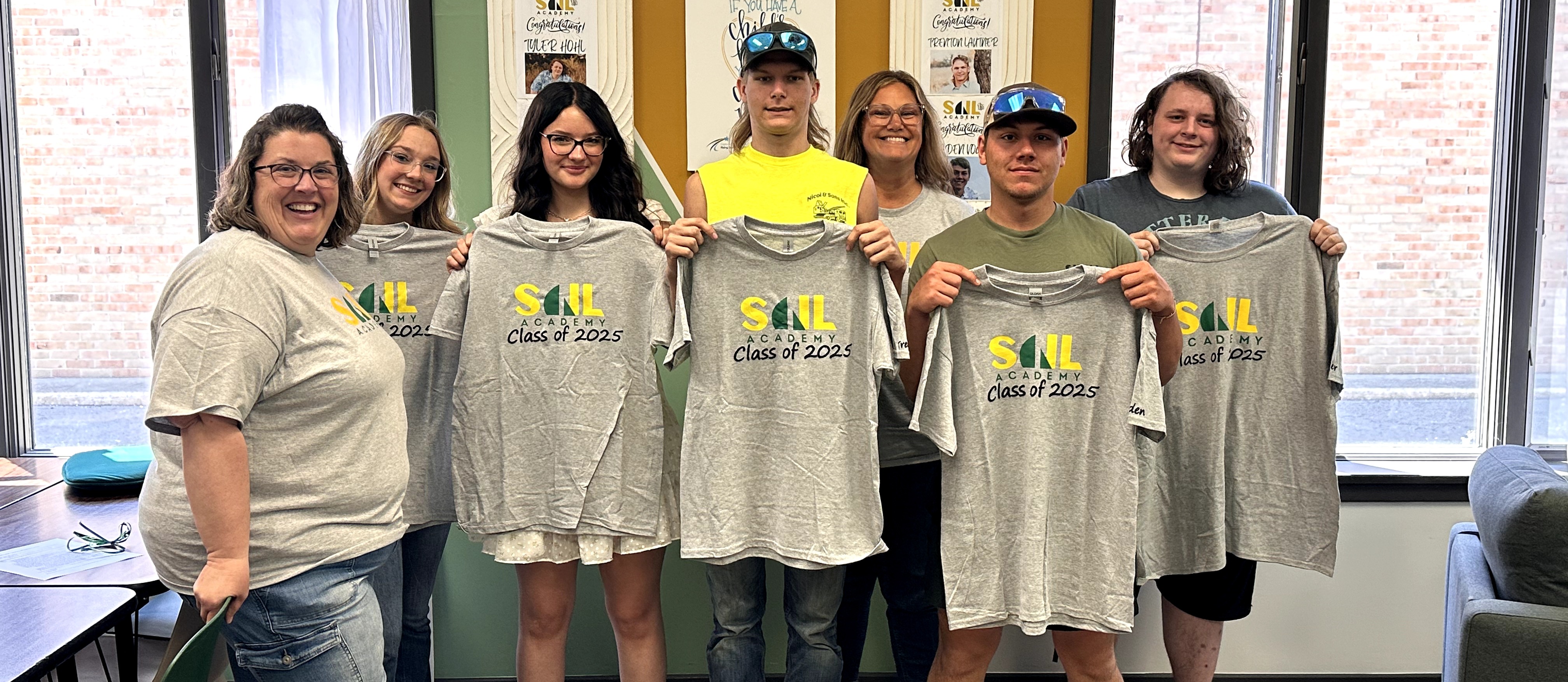 SAIL graduates with shirts