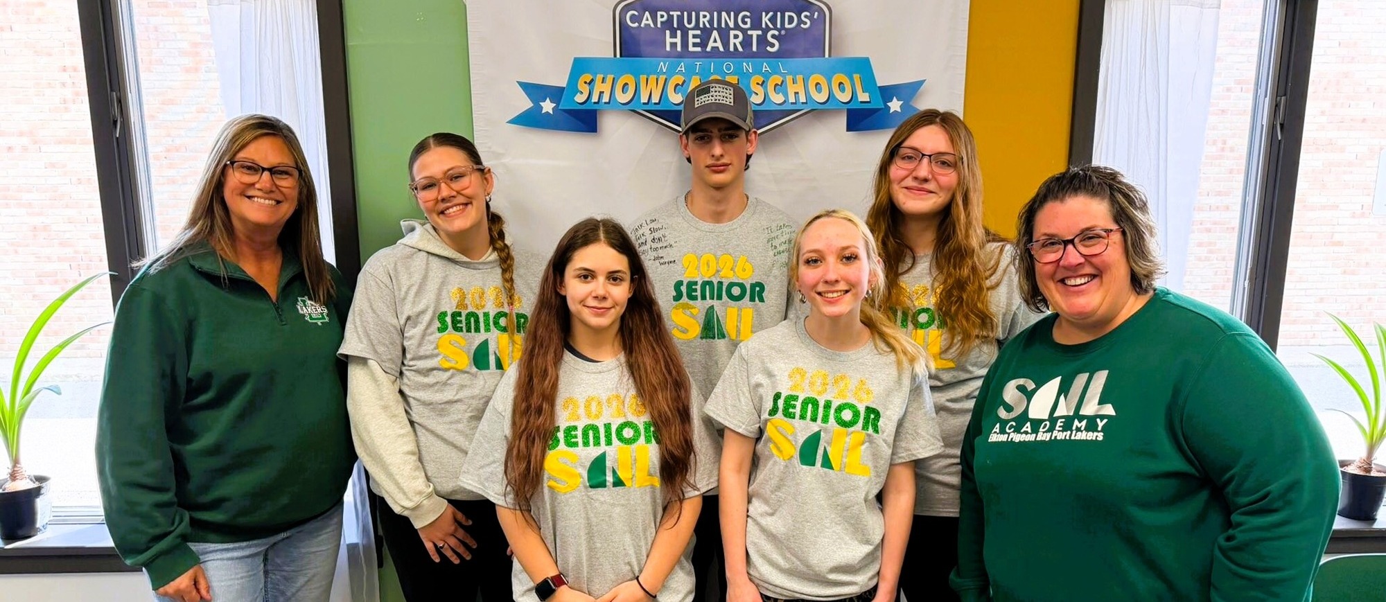 SAIL graduates with shirts