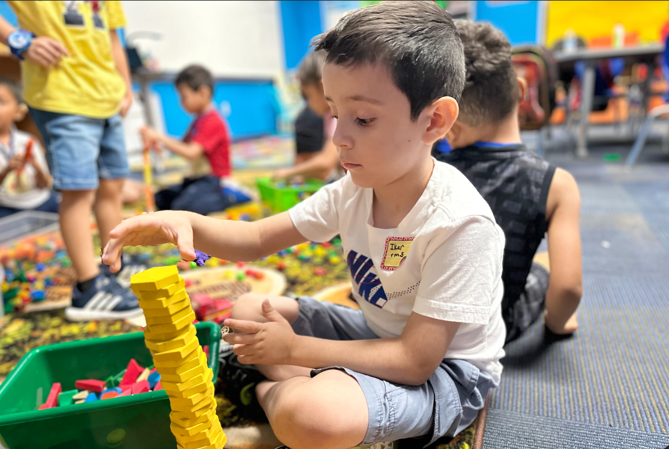 kid playing with blocks