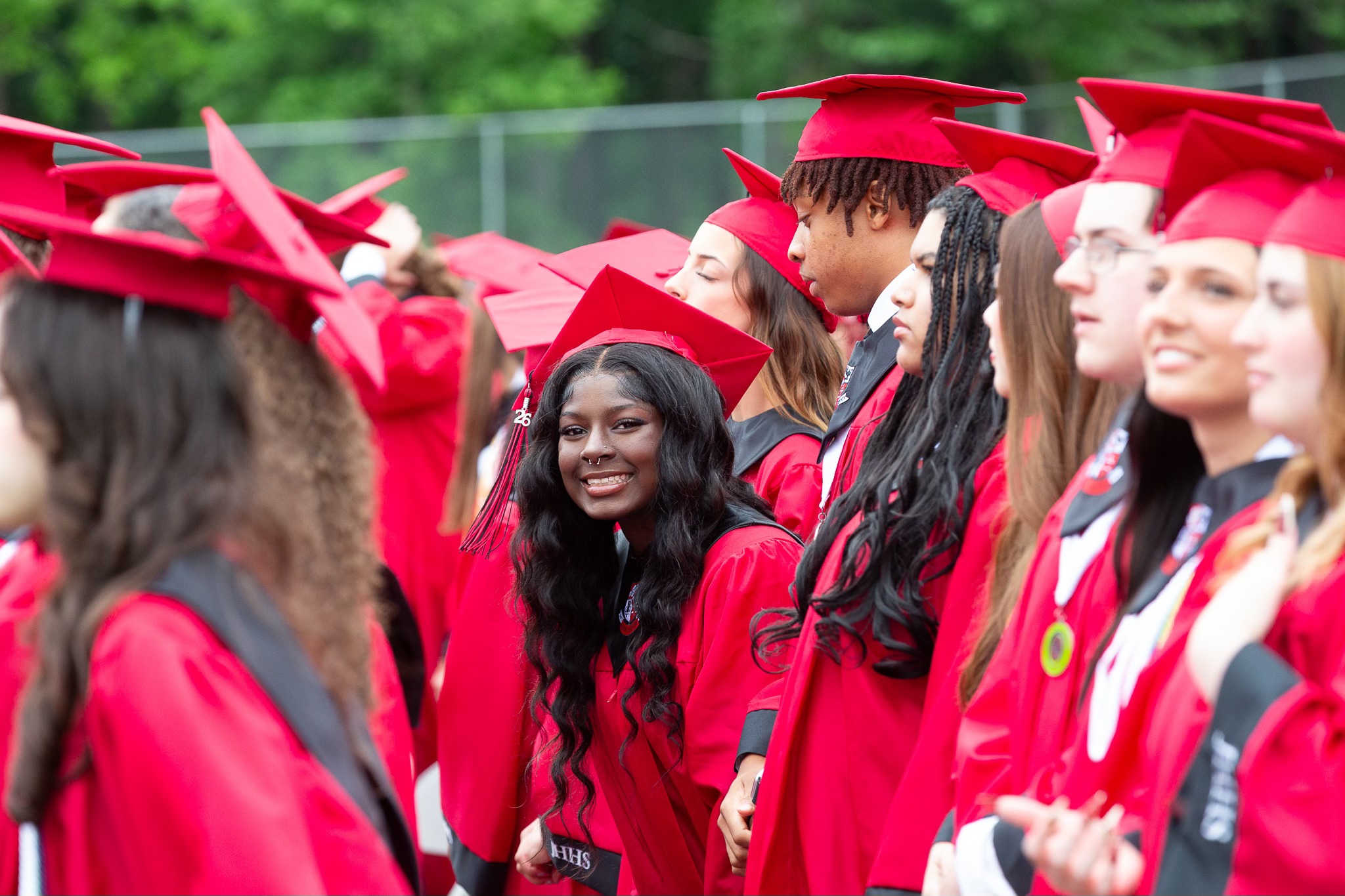Student smiling in graduation robe