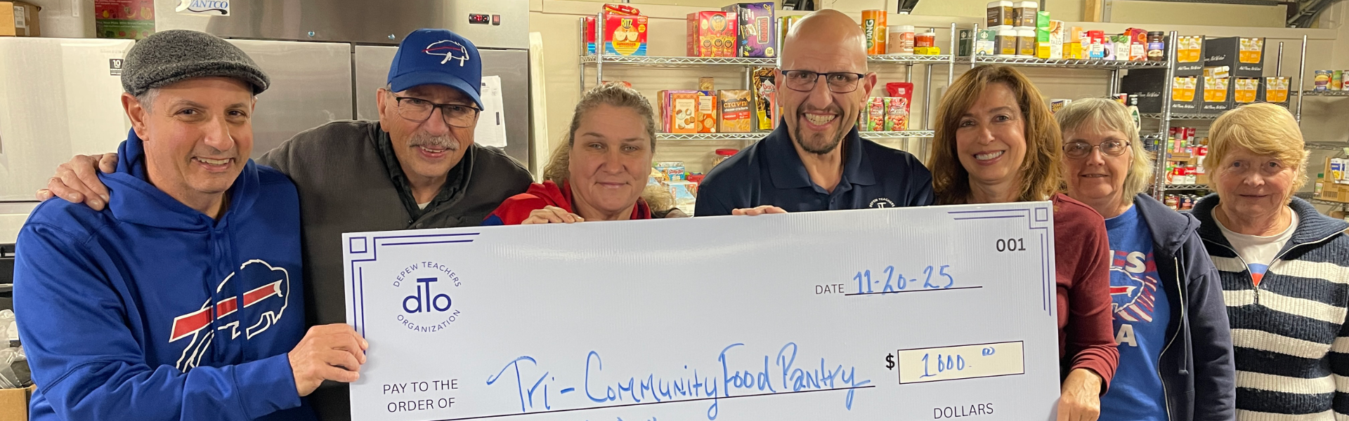 dto presenting check to local food pantry