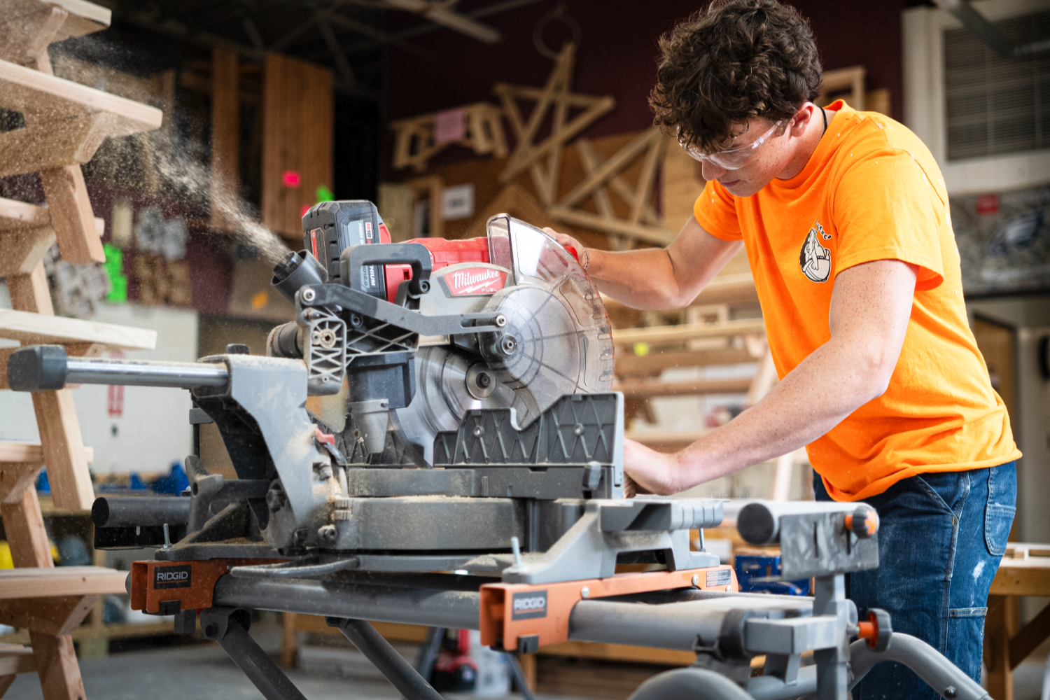 The image of a student aren't sure working on a circular saw