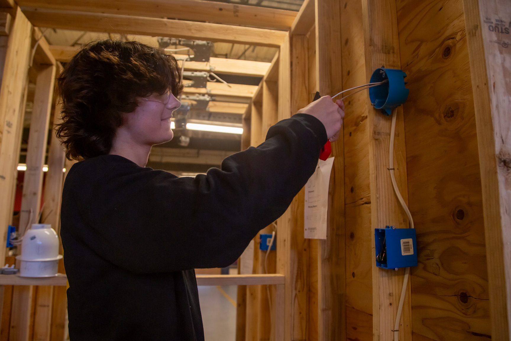 An electrical student doing some wiring
