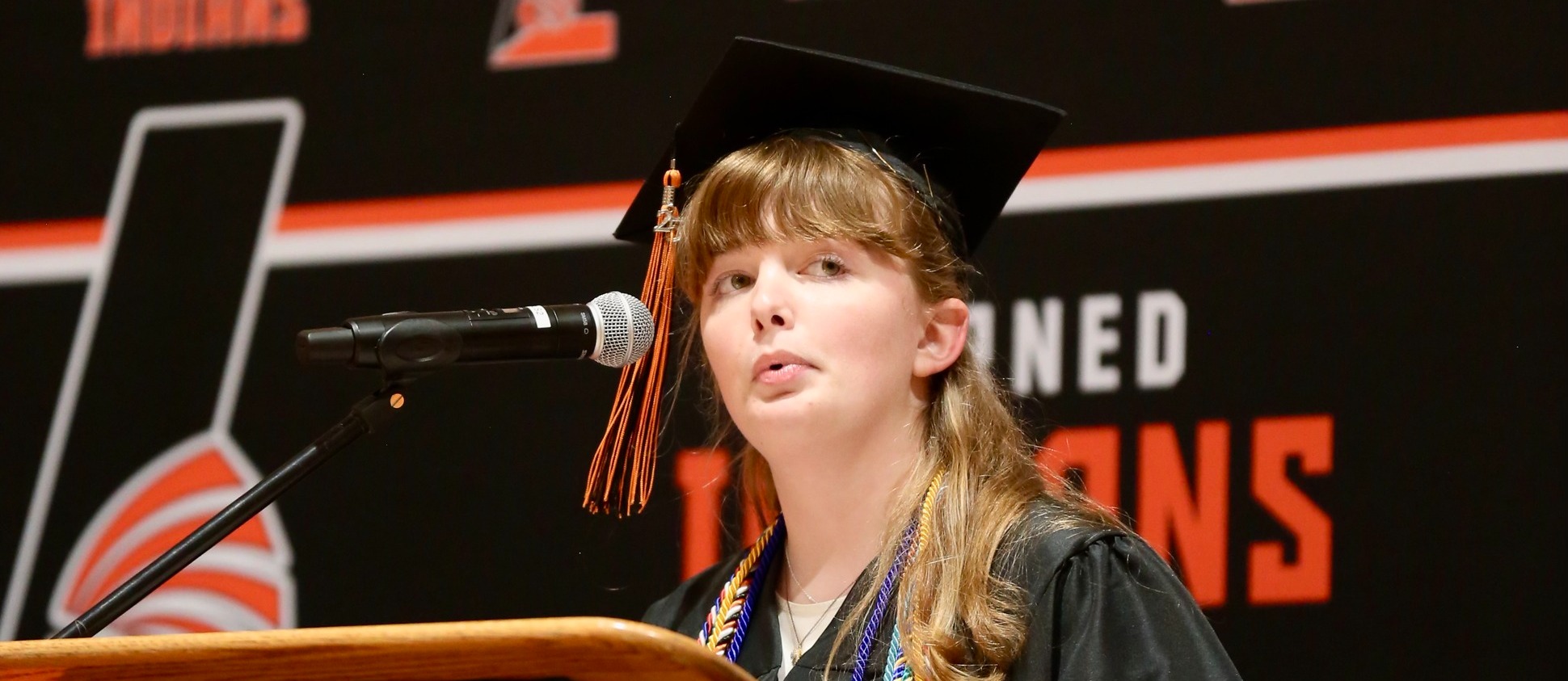 Erin Tims giving a speech at graduation