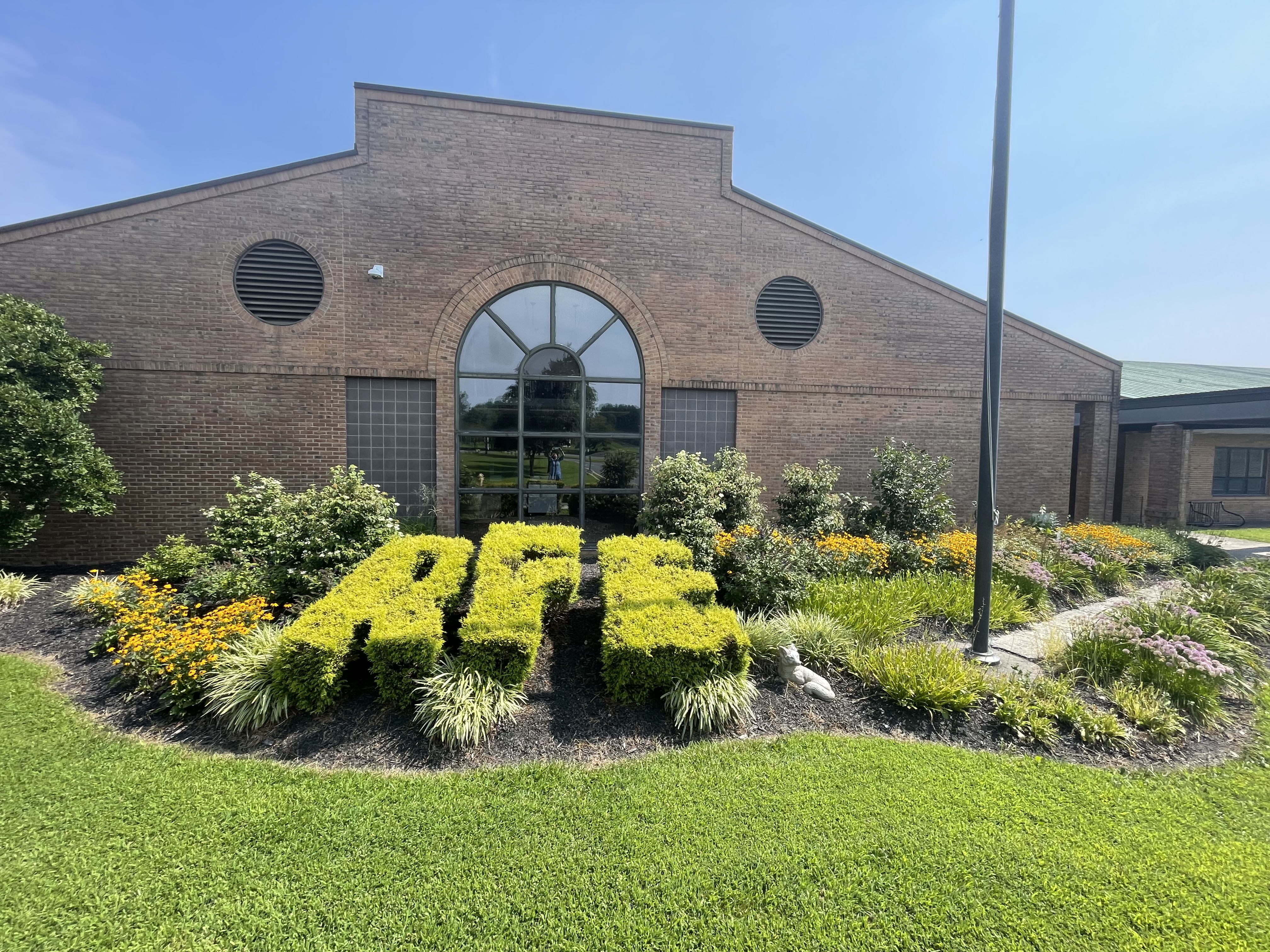 front of the Ring Factory School Building. 