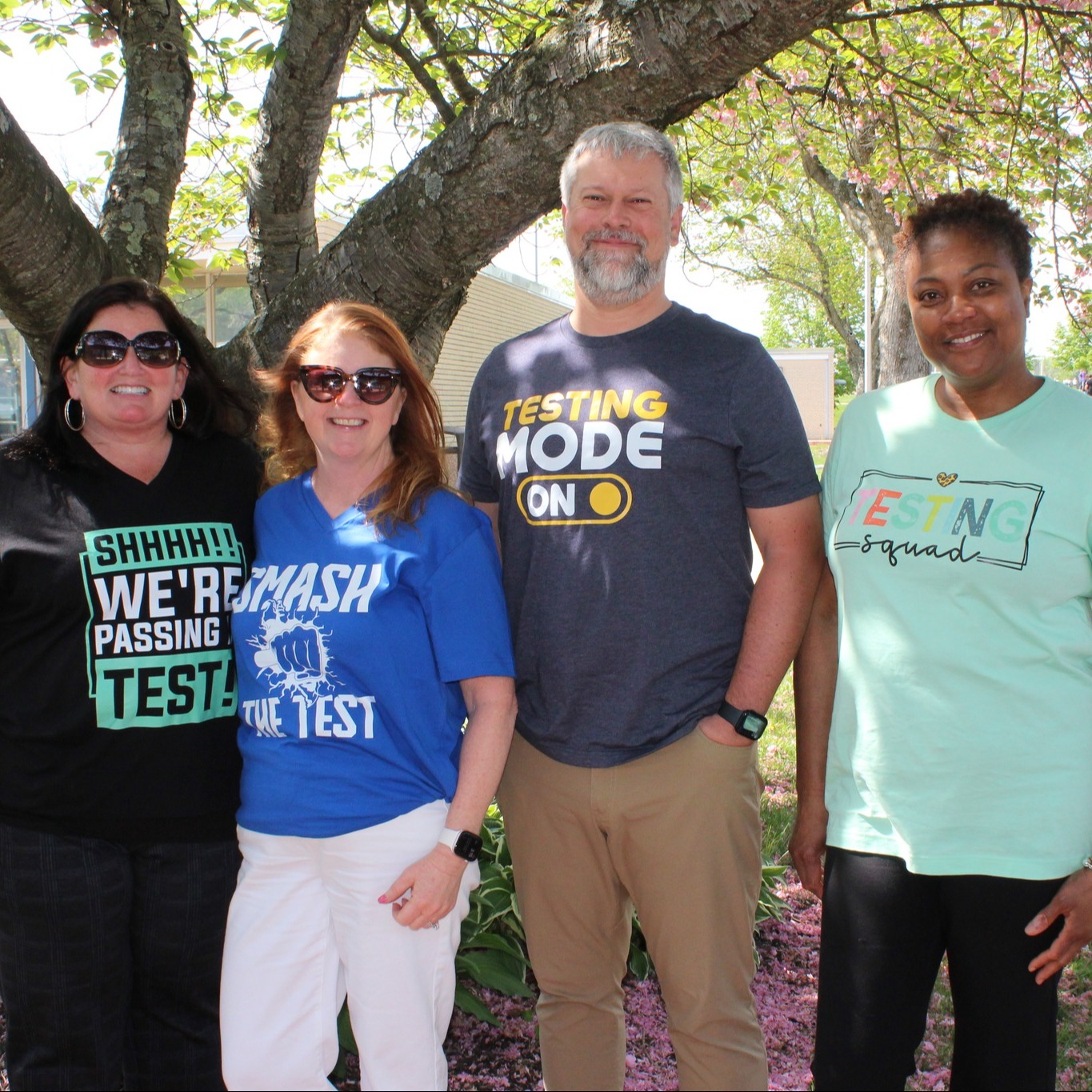 Bel Air Middle School administrators pose in front of a tree outside the school