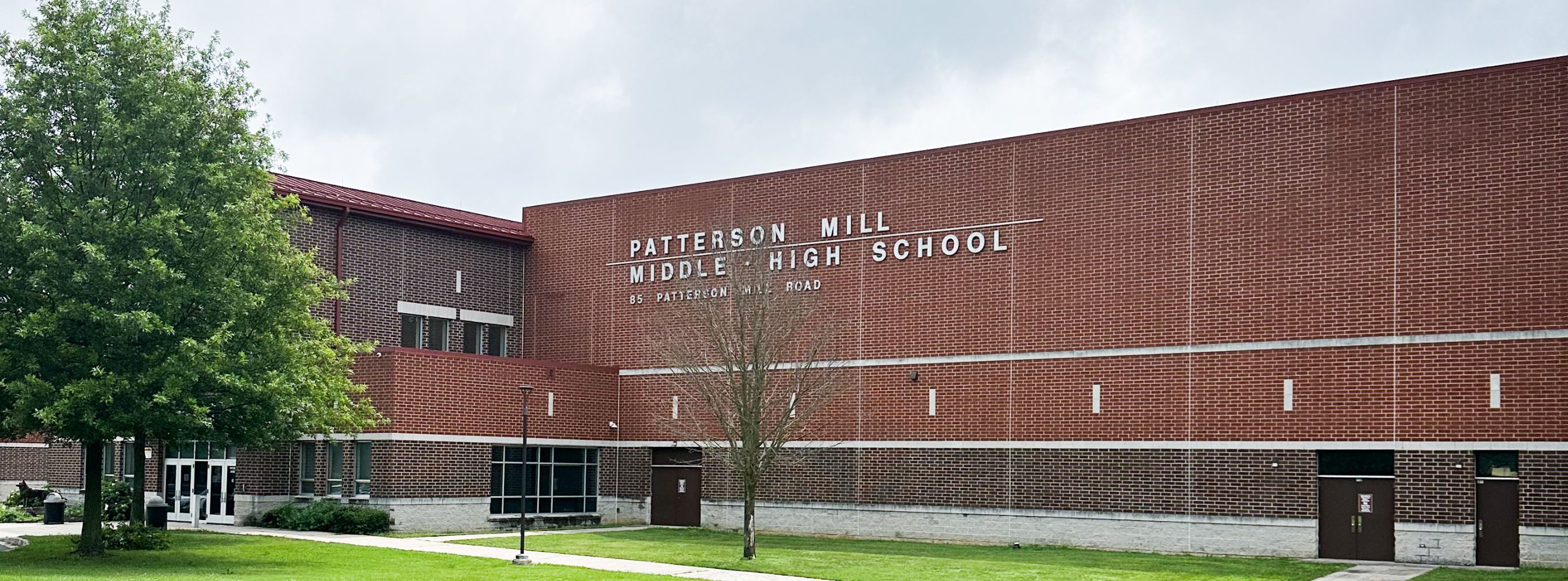 Front of the Patterson Mill building showing main entrance and school name with address