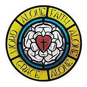A circular emblem featuring a white rose with a red heart and a black cross in the center, surrounded by a yellow ring inscribed with the words 'Word Alone', 'Faith Alone', 'Grace Alone'.