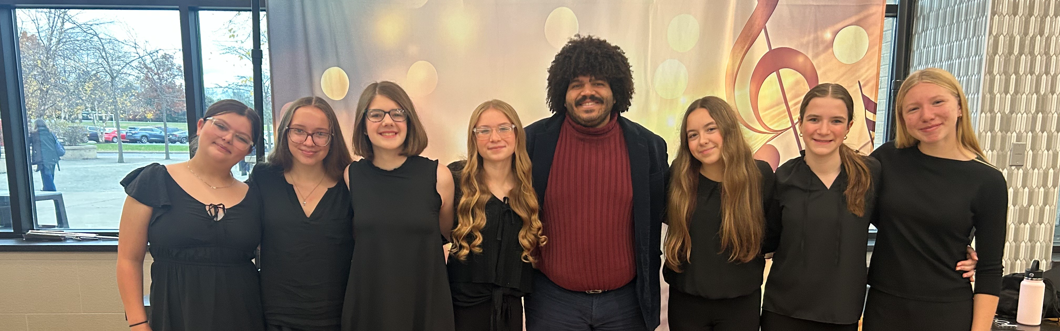 area all state students pose with teacher