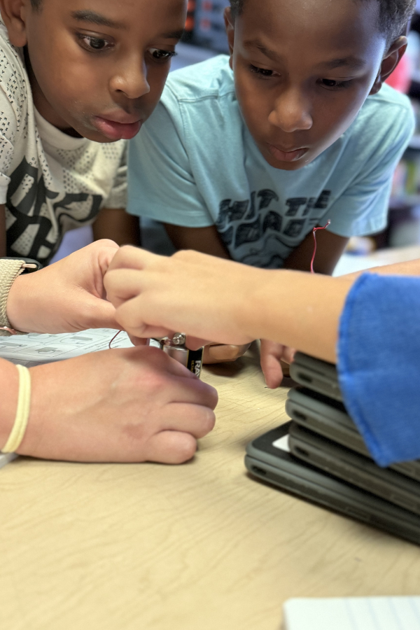 Students performing science experiment