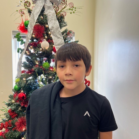 boy with christmas tree background