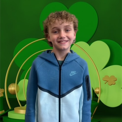 BOY WITH GREEN BACK GROUND