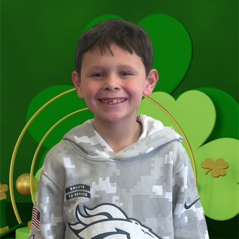 BOY WITH GREEN BACK GROUND