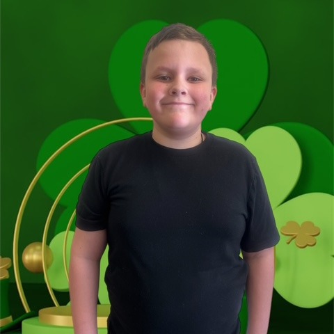 BOY WITH GREEN BACK GROUND