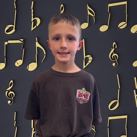 BOY WITH MUSICAL BACKGROUND