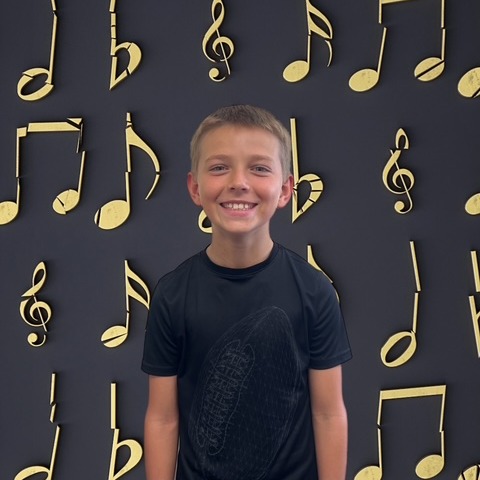 BOY WITH MUSICAL BACKGROUND