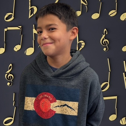 BOY WITH MUSICAL BACKGROUND