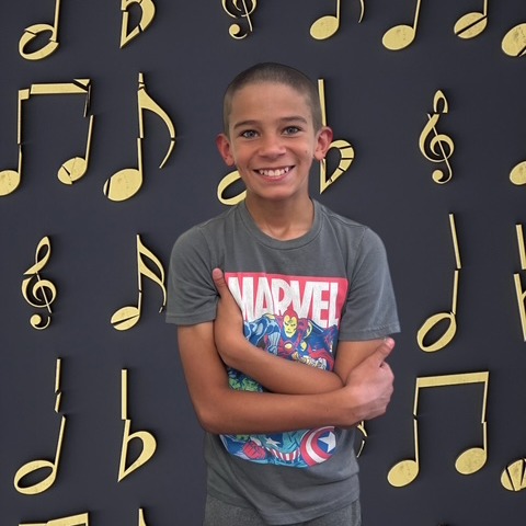BOY WITH MUSICAL BACKGROUND