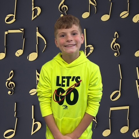 BOY WITH MUSICAL BACKGROUND