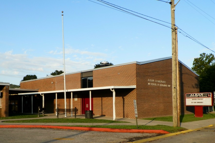The outside of the school building on a clear day.