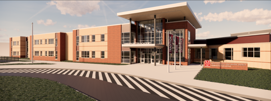 A modern school building featuring a large entrance with glass doors, surrounded by landscaped grass and a striped crosswalk in the foreground.