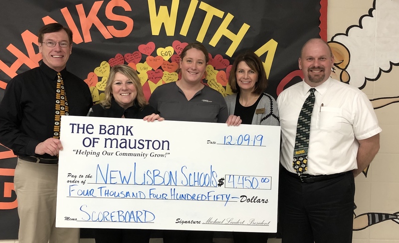 New Lisbon school holding a check