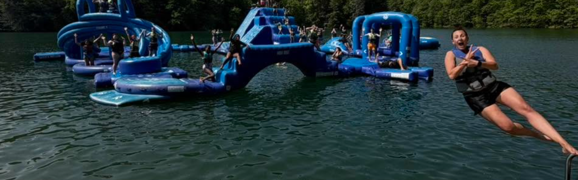 Lake with person jumping in.