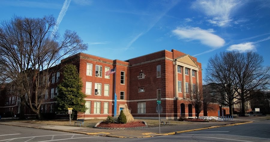  a picture of a three story brick school building