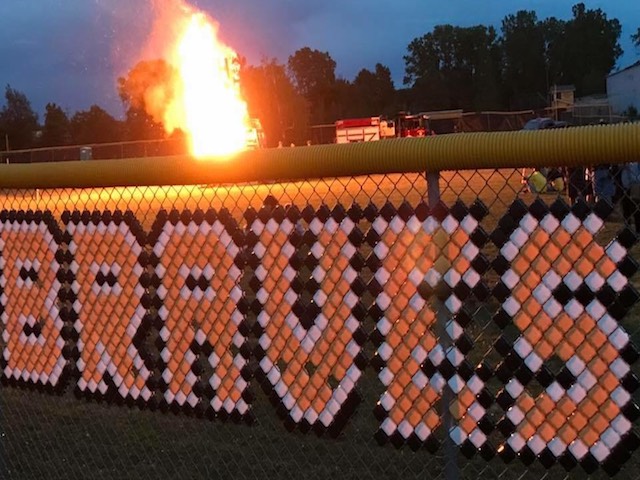 "Braves" formed along a fence