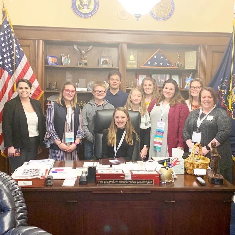 PYD group photo around a desk