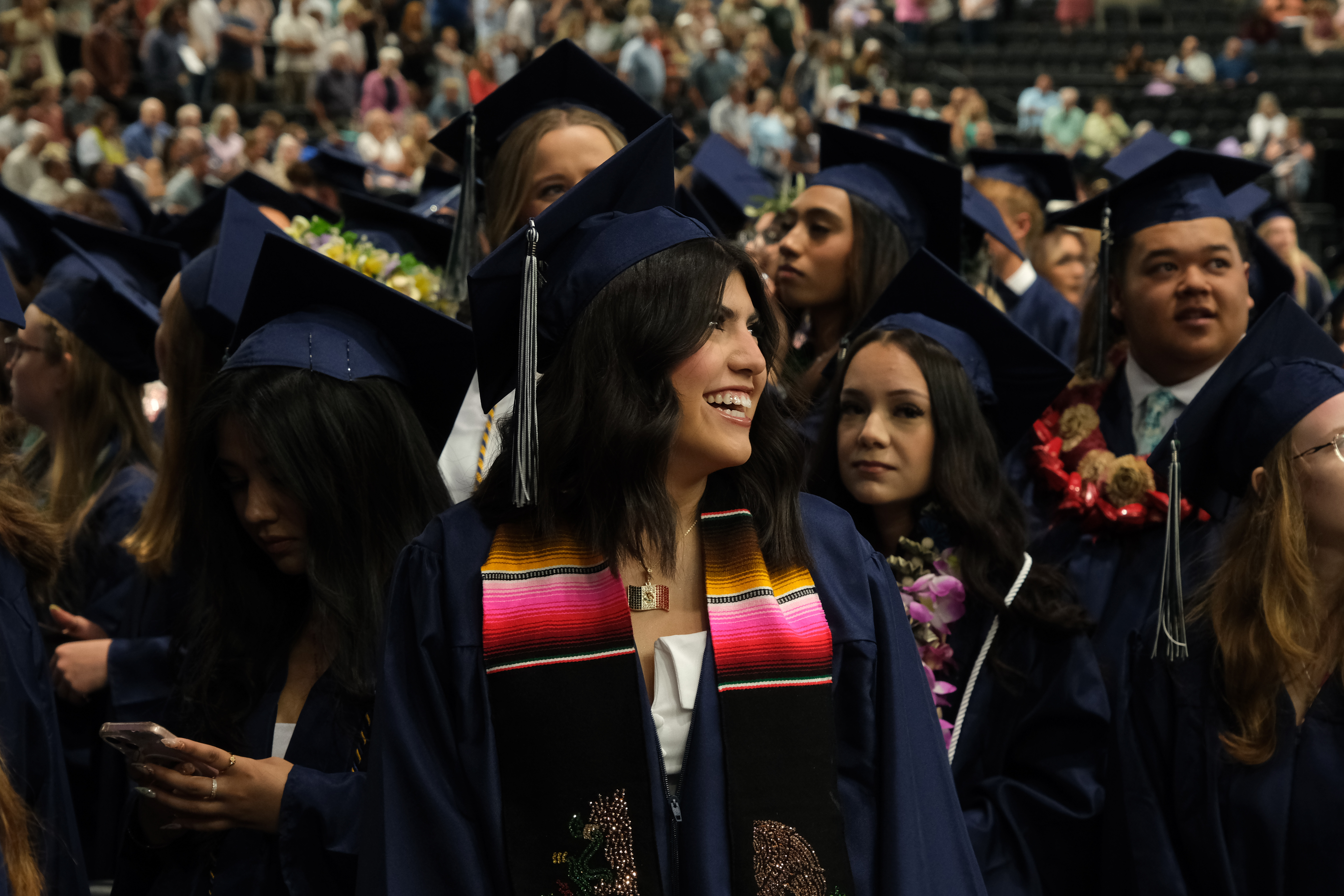 a graduating senior at Timpanogos High School celebrates during graduation ceremony