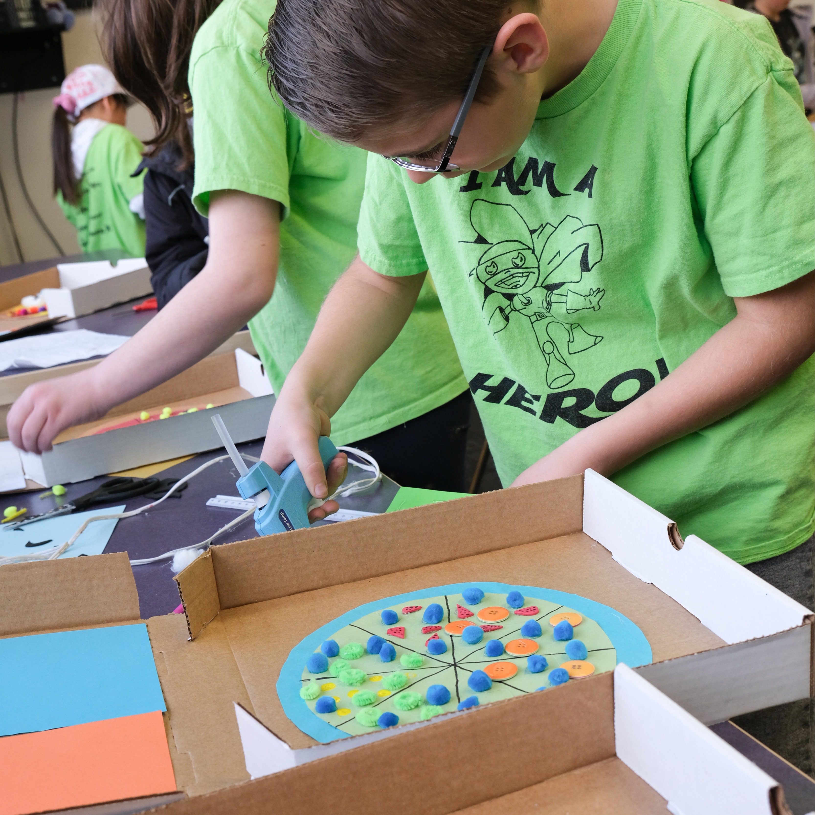a student working on a math pizza pie project