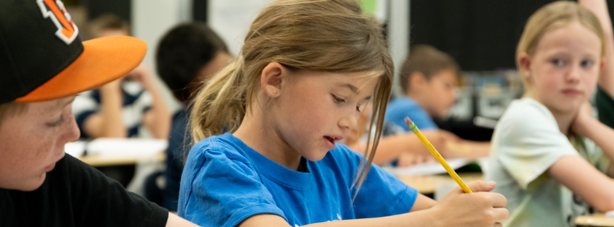 a young student working at her desk