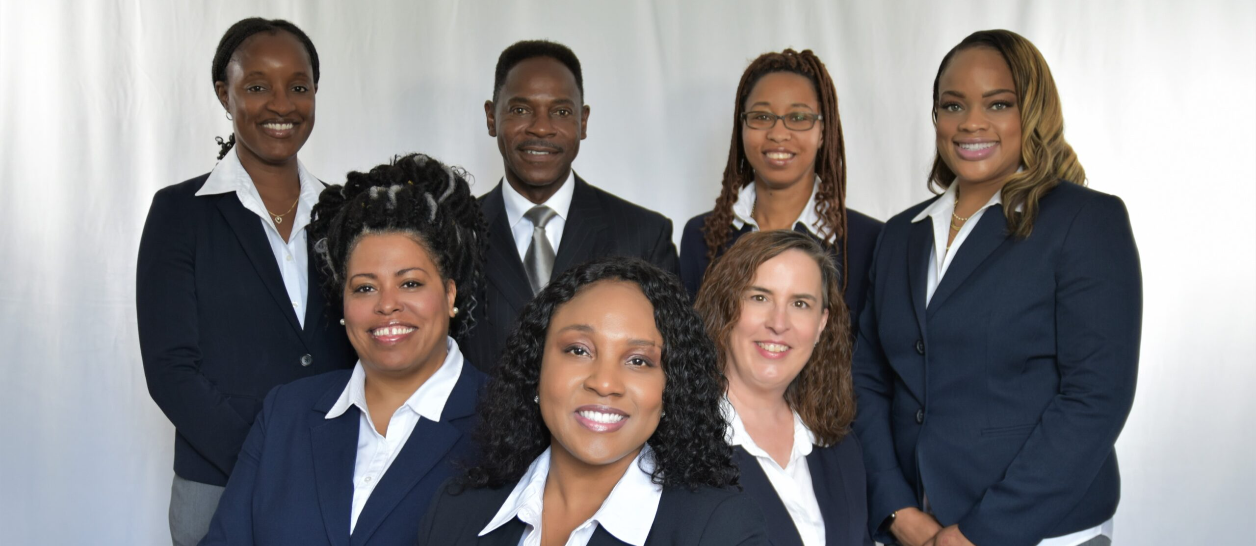 group of adults smiling in group photo