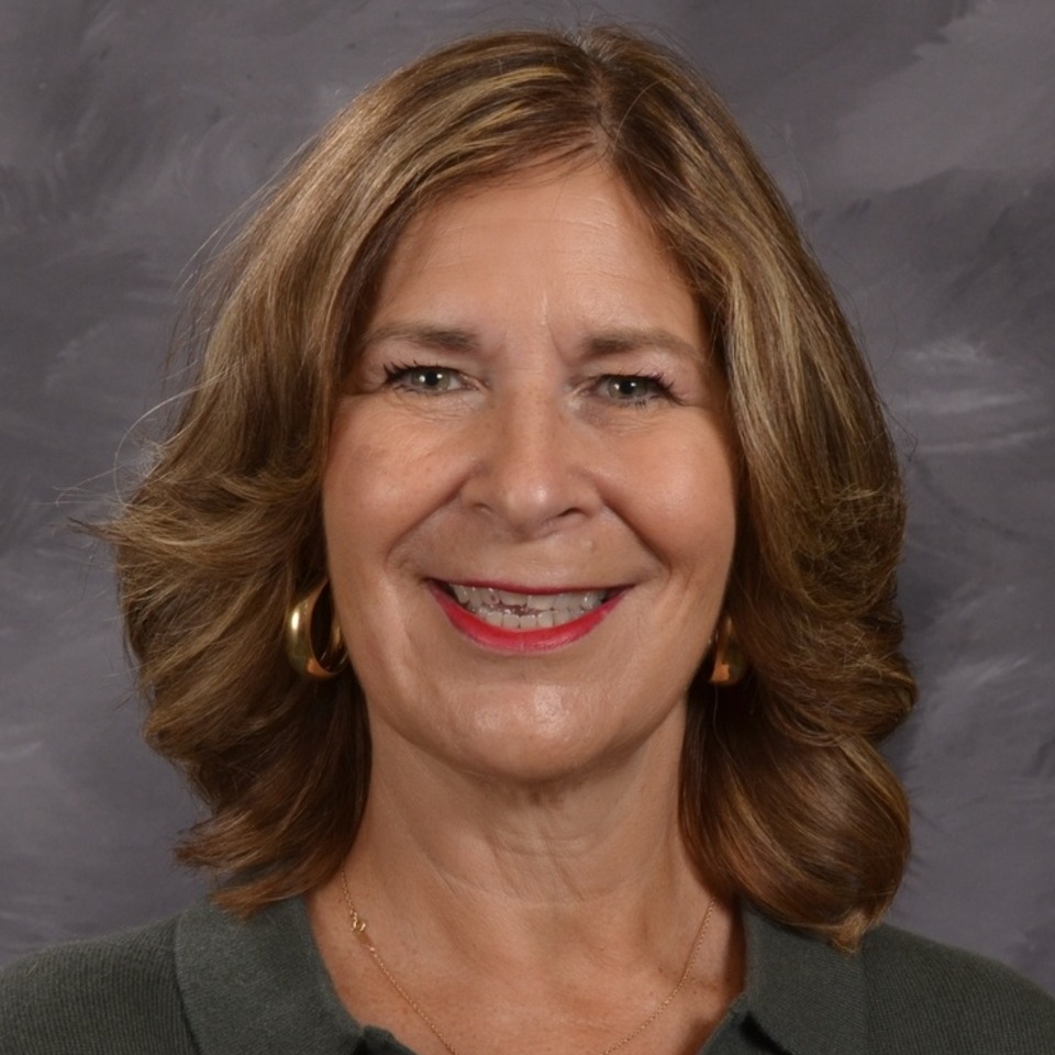 women with short brown hair, grey background
