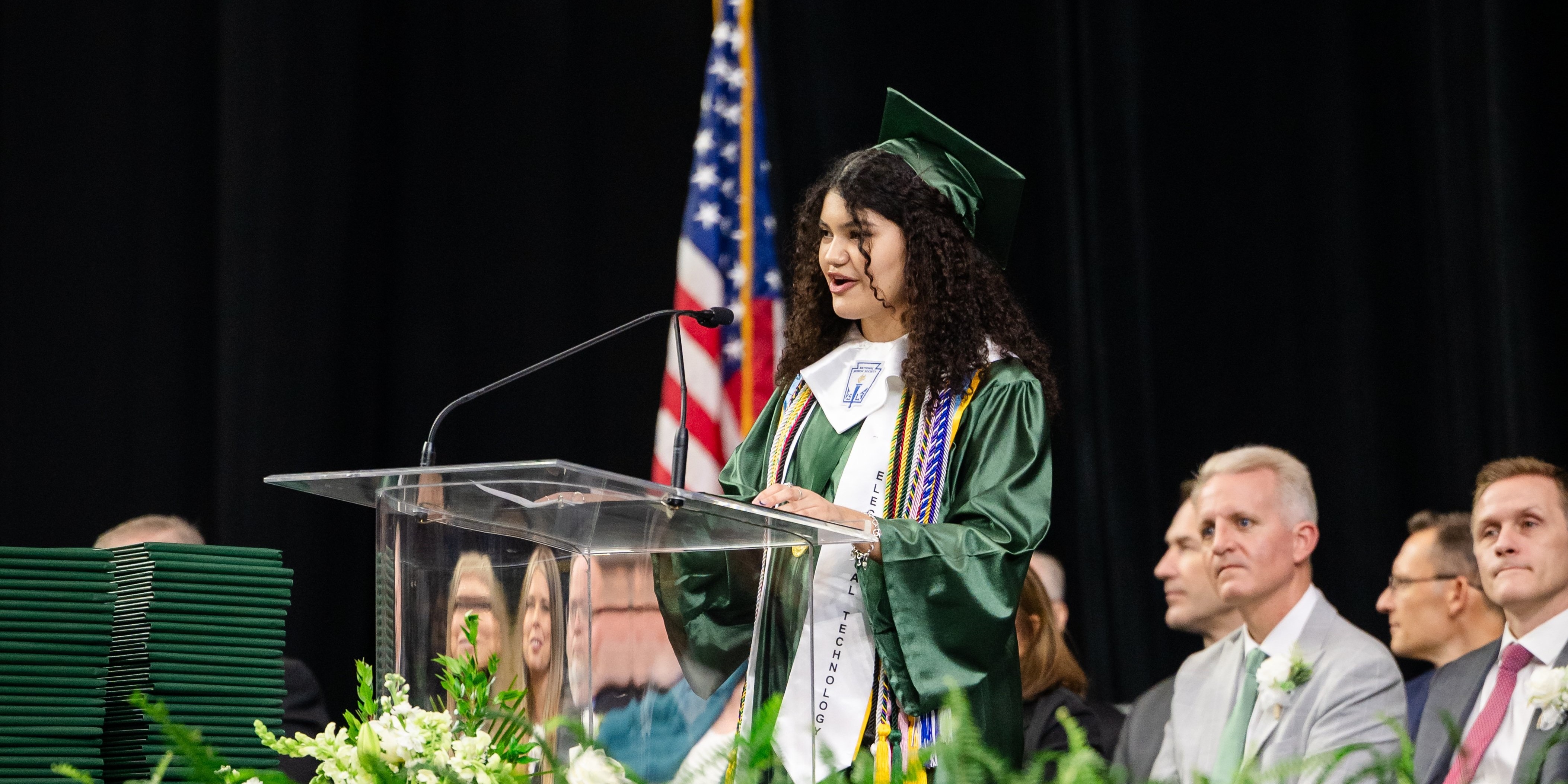 Graduate at a podium speaking