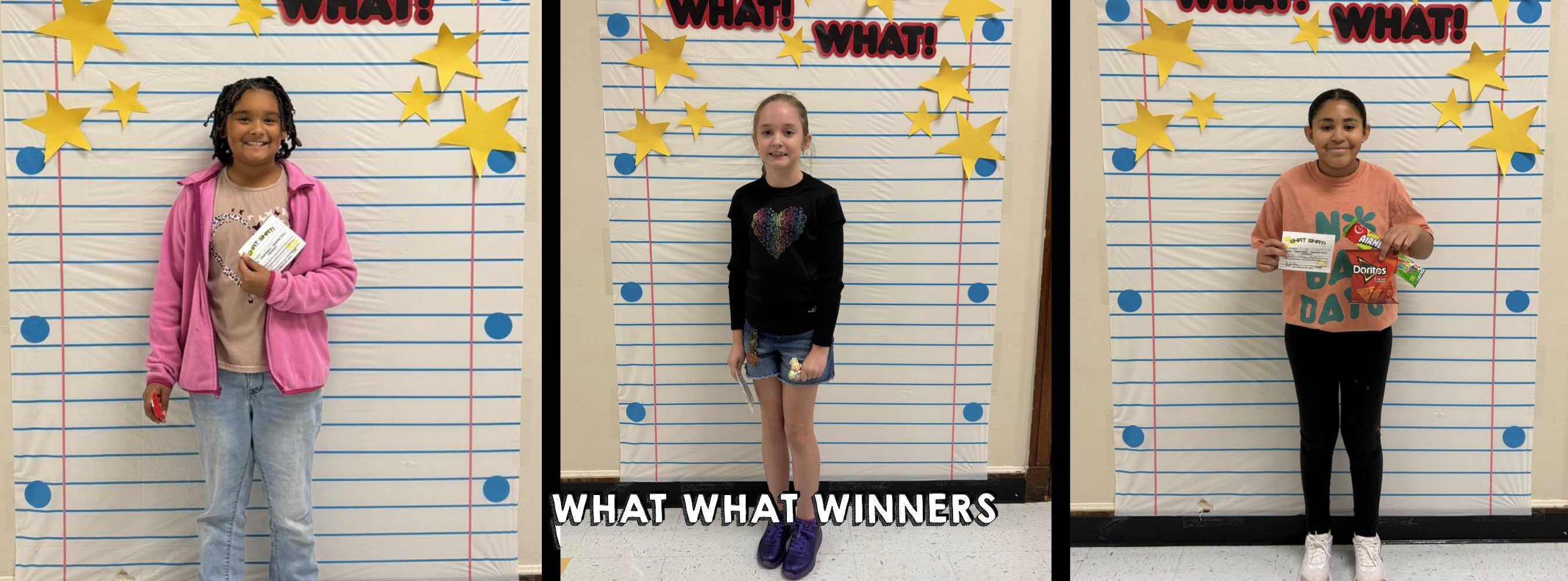 Three children stand against a backdrop of a giant lined notebook paper with stars. They hold prizes and smile. Text reads, "What What Winners."