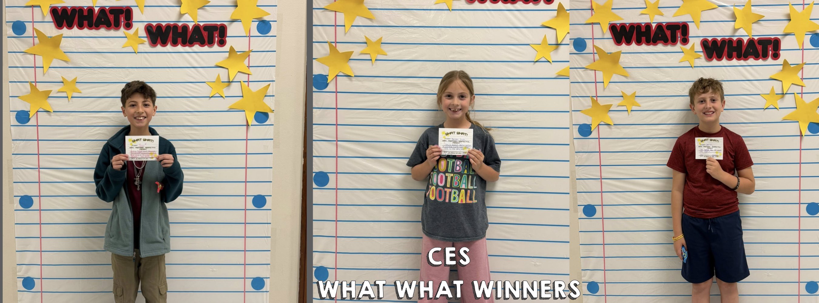 Three smiling children stand holding certificates in front of a large notebook paper backdrop with stars and "WHAT!" text. The mood is celebratory.