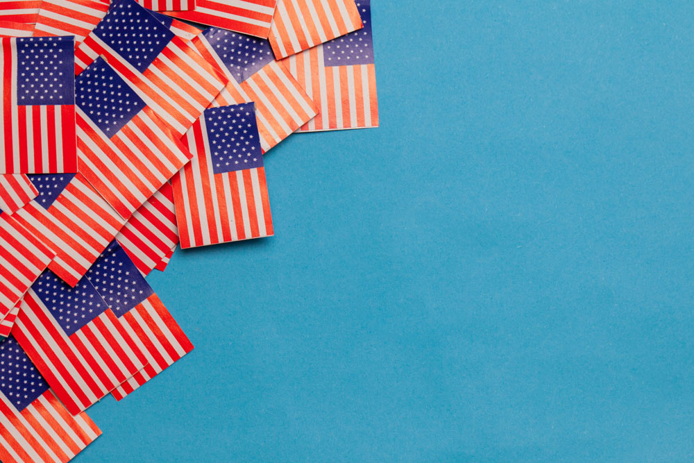 small American flags on blue background