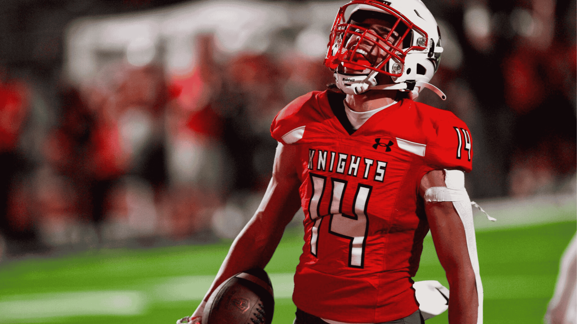 Programs Feature - Athletics: Picture of football player on the field