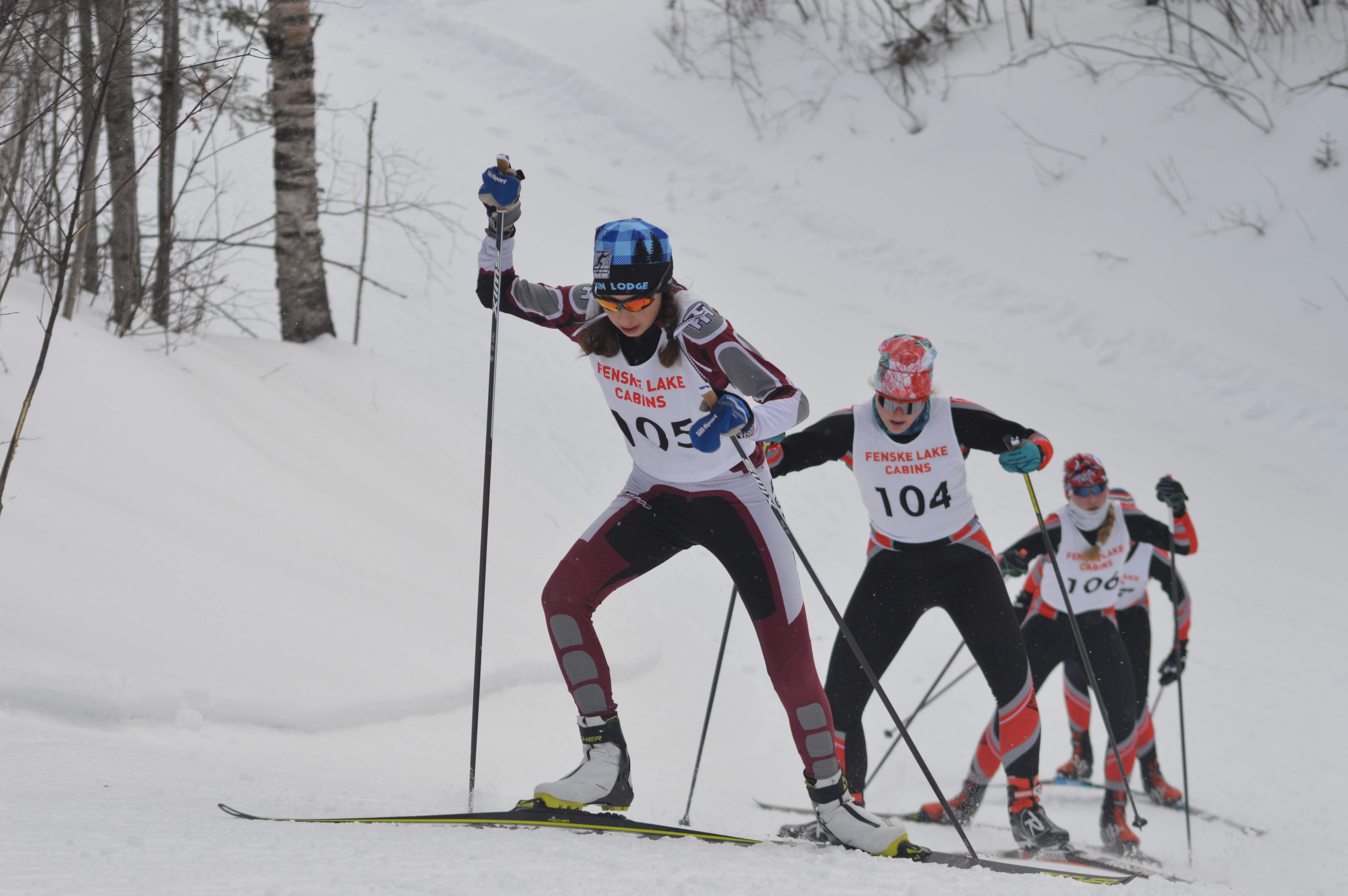 Three nordic skiers