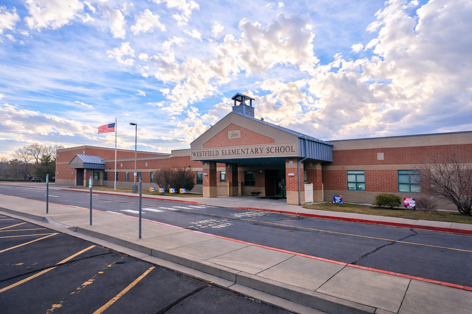 Westfield Elementary school with with flag and sky background