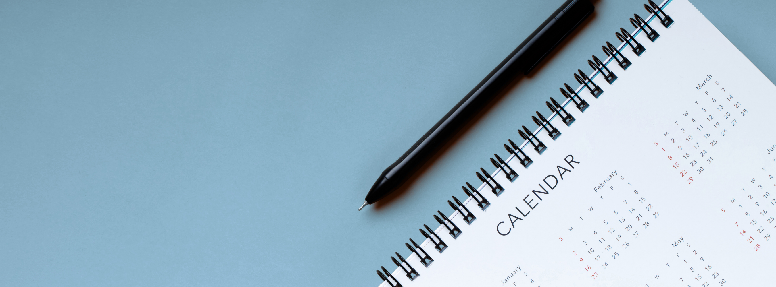 an image of a pen and calendar