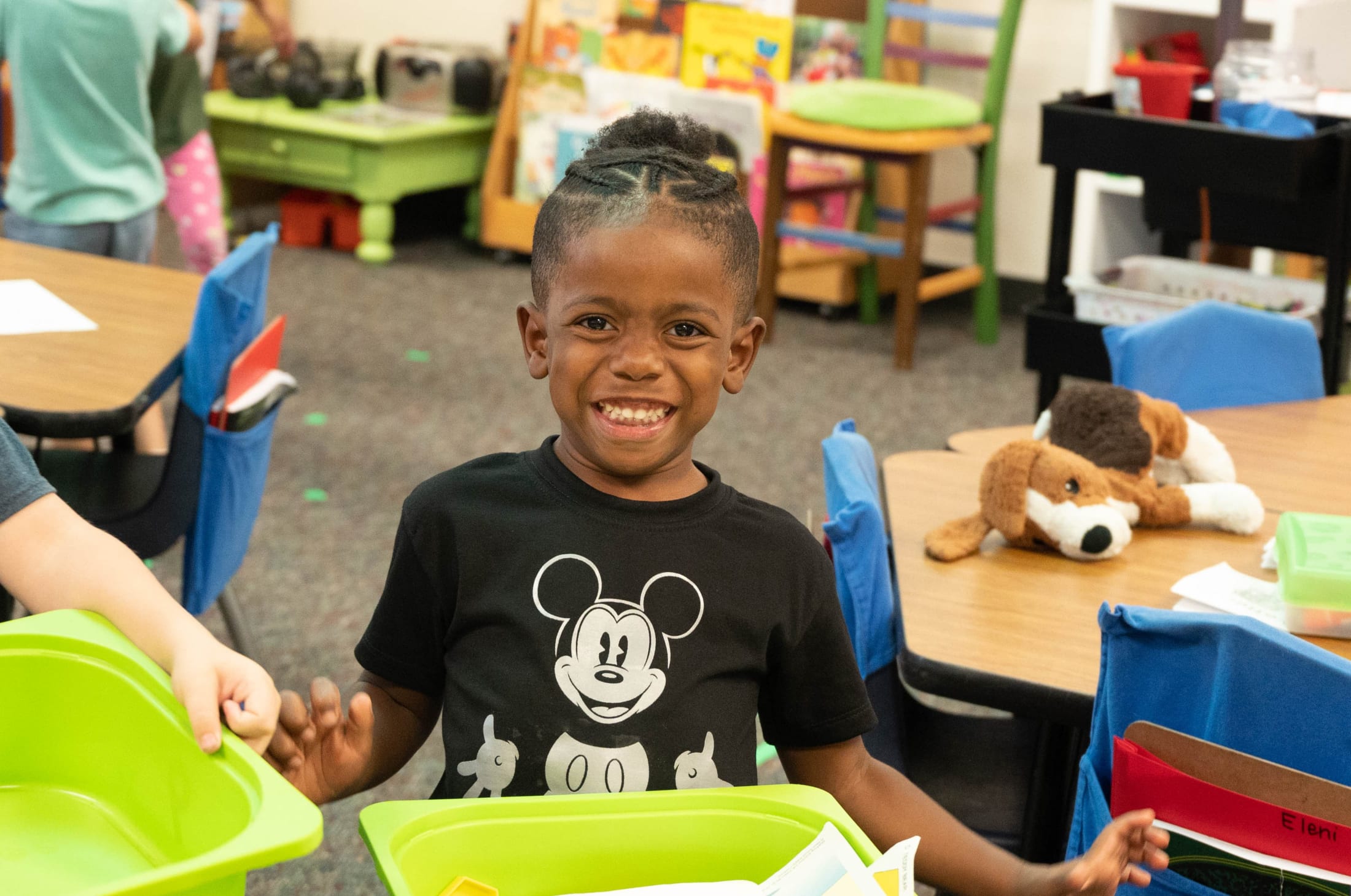 Male student smiling while playing