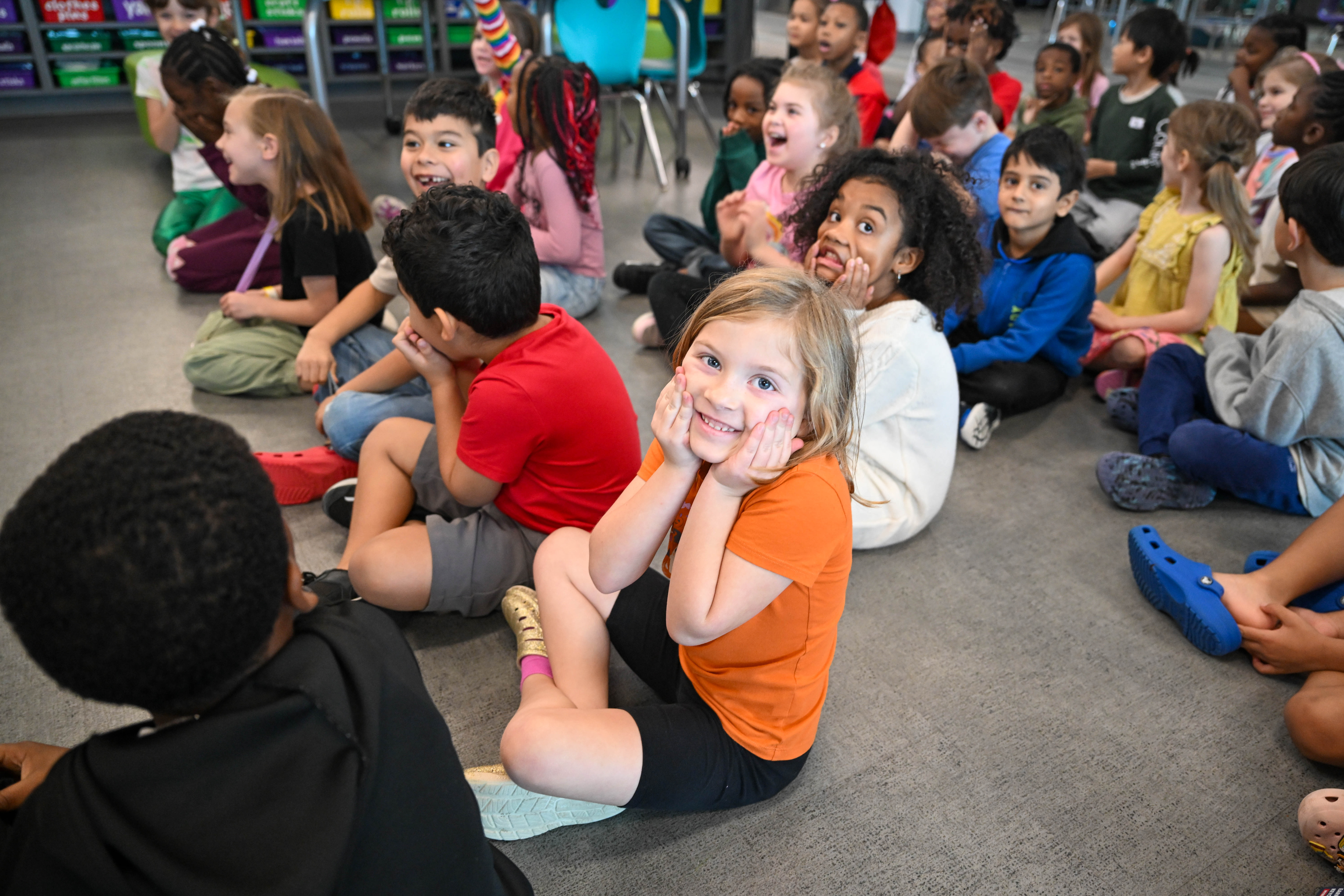 group of kids smiling and making faces