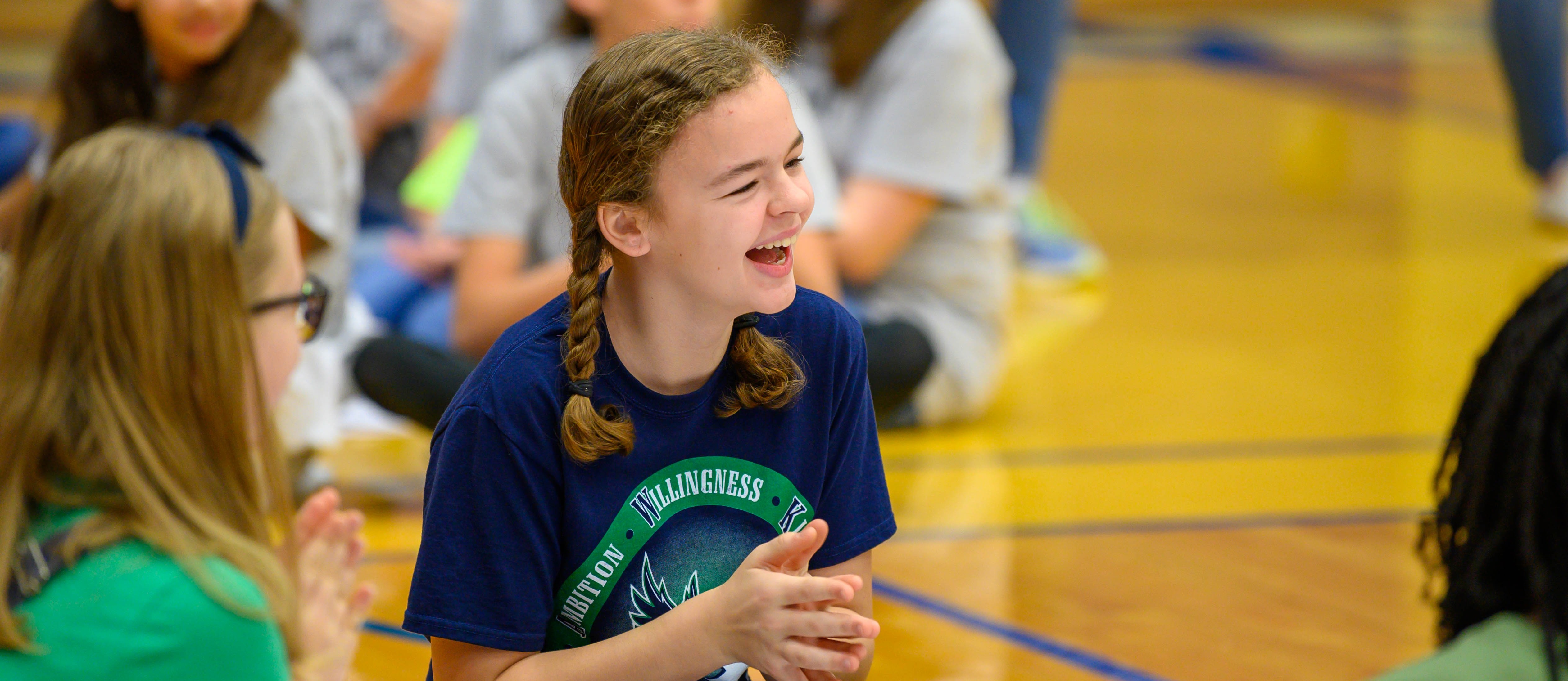 girl smiles in gym