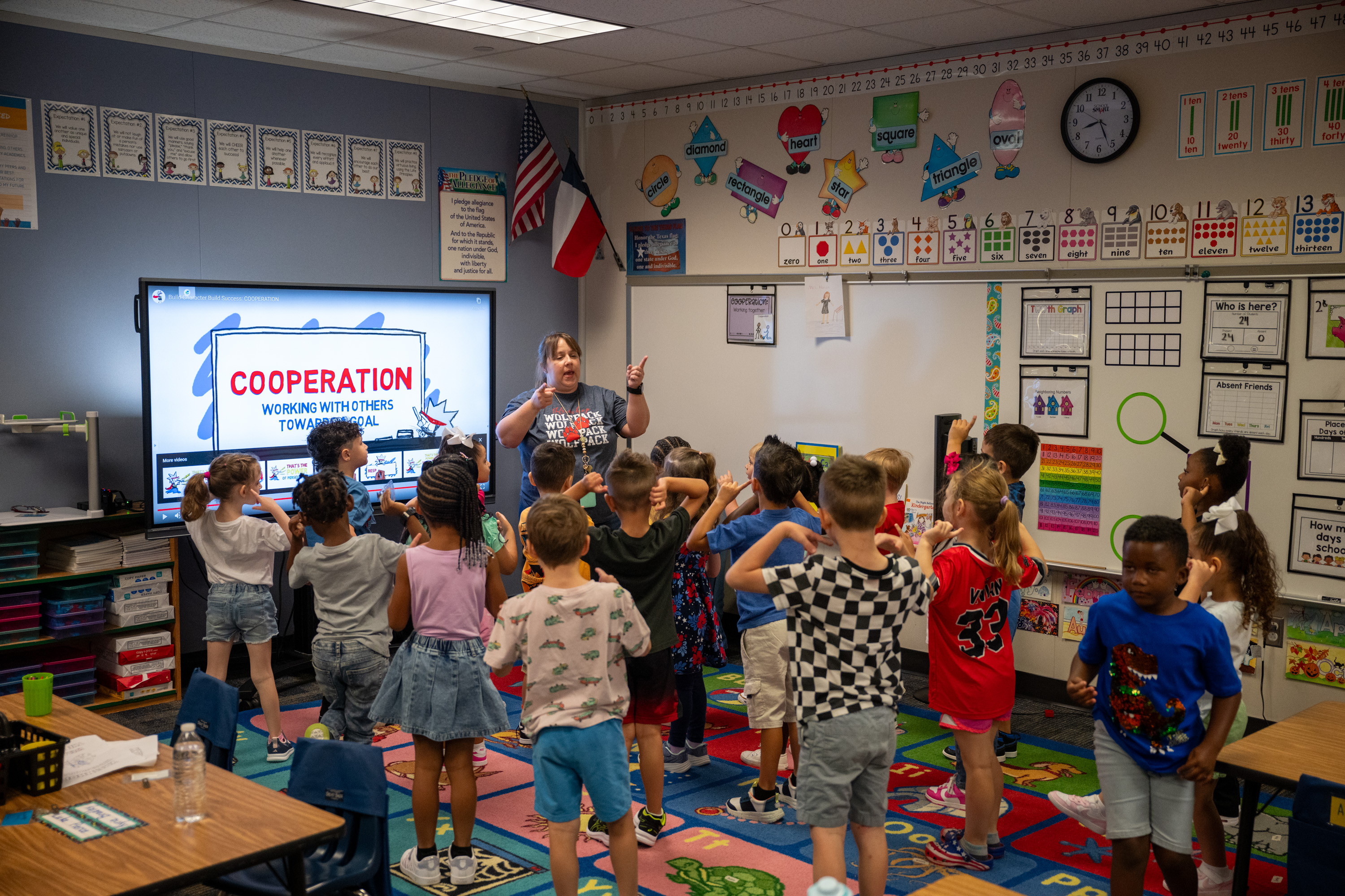teacher reading to students in classroom